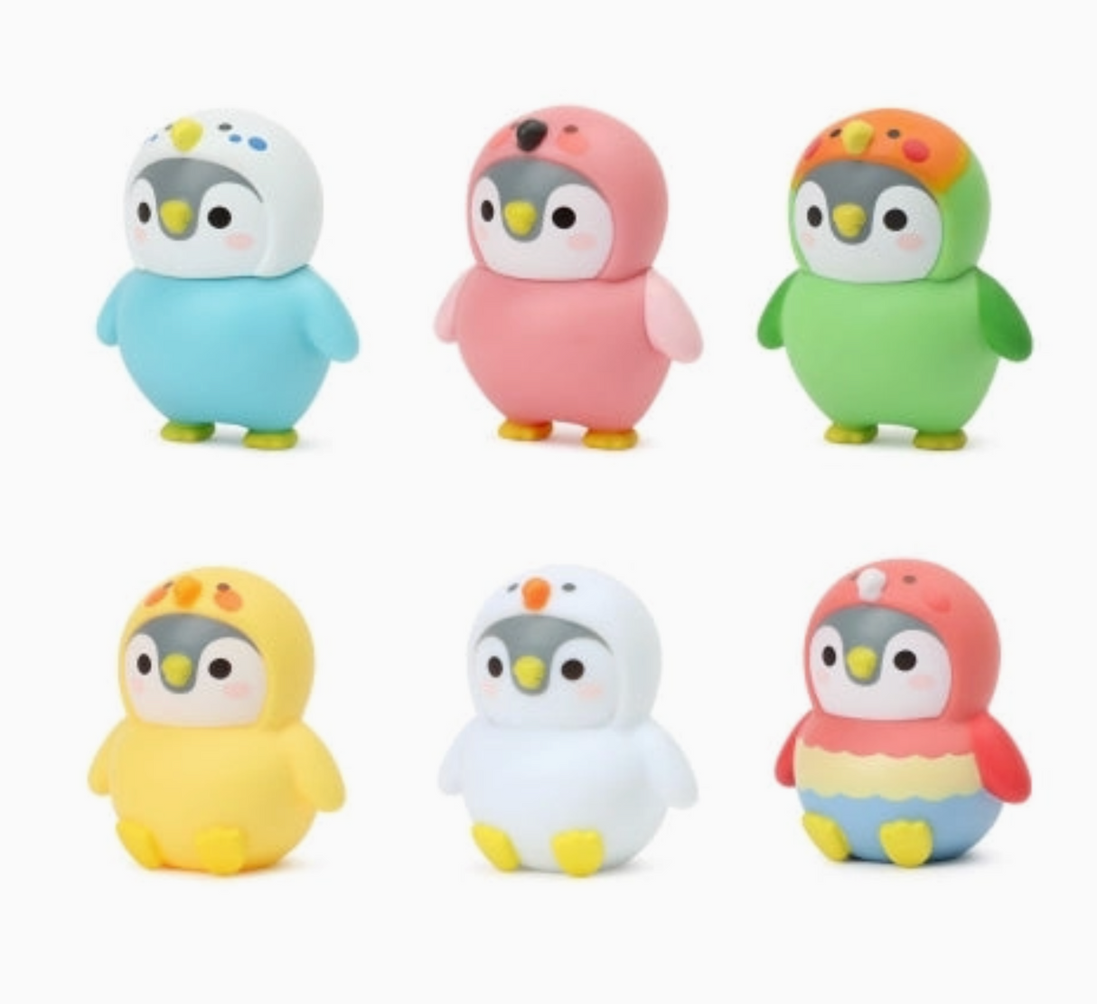 Set of colorful penguin figurines on a white background